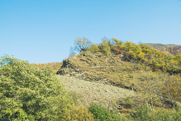 Panorama overlooking the mountains in the clouds. Landscape of the Caucasus Mountains. Fall. Day Georgia.