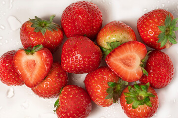 Fresh strawberries close-up, in a cut on a white background