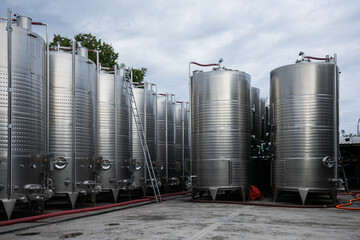 Steel tanks for winery fermentation outdoor on the wine factory yard