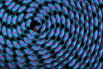 A 10.2 mm rope coiled on a table to form a repetitive design