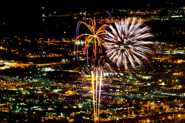 View of the Boulder, Colorado July 4th fireworks display from the top of the Flatirons.