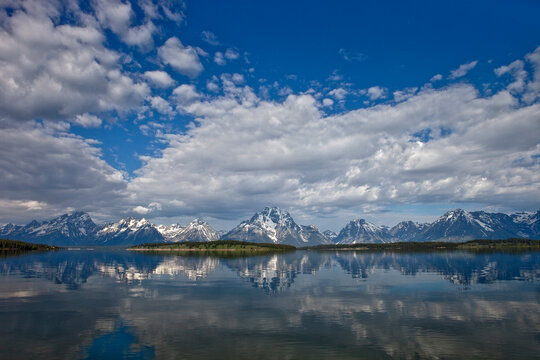 teton mountain range reflected in Jackson lake in grand teton national park, Wyoming