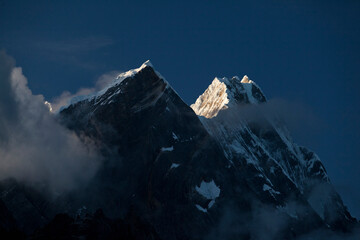 First light hitting Rondoy at 5879 meter in the Cordillera Huayhuash of the Andes Mountains in Peru.