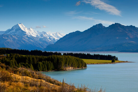 Early morning sun lights the summit of Aoraki / Mt. Cook and adjacent peaks in New Zealand's Southern Alps in Aoraki/Mt. Cook National Park in the South Island.