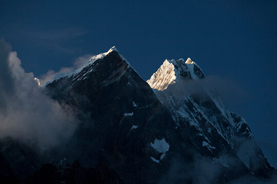 First light hitting Rondoy at 5879 meter in the Cordillera Huayhuash of the Andes Mountains in Peru.