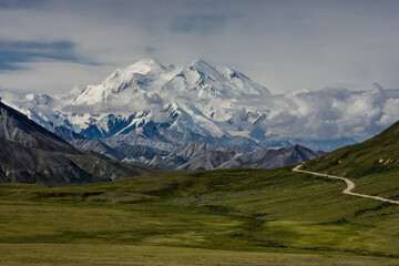 Mount McKinley, known locally as Denali, or The High One, soars above the clouds in Denali National Park, Alaska.