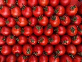 Red cherry tomatoes background,natural pattern. Top view,vegetable backdrop. 