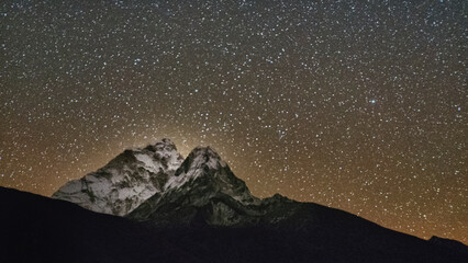 Ama Dablam is known as one of the most impressive mountains in the world. The main peak is 6,812 meters or349 ft. It glows as the stars come out in Dingboche, Nepal.