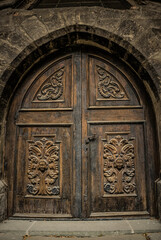 Fototapeta na wymiar Old wooden door in the church