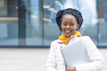 African american black female girl student remote studing, working, using laptop outdoor. back to school. preparation and passing of exam at college, university. copy space, text