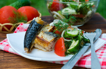 Baked mackerel and salad on a plate