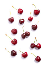 Obraz na płótnie Canvas Cherries on white background, wallpaper for food store. Natural red berries for vitamins nourishment, healthy dieting