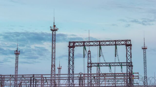 power station antenna power lines lightning rods clouds atmosphere in a thunderstorm. dynamically passing clouds. timelapse 4k. concept energetics natural phenomena. blue color.