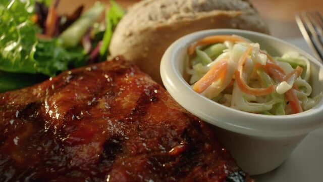 Chicken and Ribs Dinner with Salad and Coleslaw 