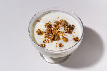 Homemade oatmeal granola with yogurt in a bowl