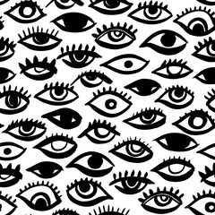 Seamless pattern with eyes and eyelashes. Black and white ink illustration. Free hand drawing bohemian style. Tribal print of open eyes. Ethnic background for web, fabric design, scrapbook elements