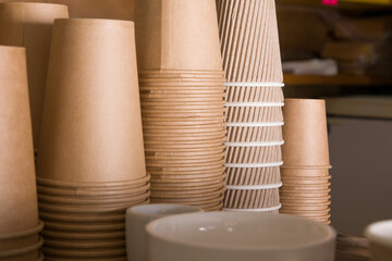 Lots of cardboard cups for takeaway coffee and tea, selective focus