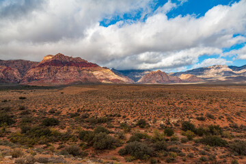 Naklejka premium Late Morning Sun and Clouds on La Madre Mountain Range Wilderness, Bridge Mountain and White Rock Hills from Lower Red Rock Parking Area