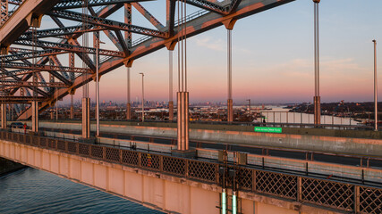 Fototapeta premium Historic Bayonne Suspended Arch Bridge over Kill Van Kull at Sunset - NJ & NY Route 440 - Bayonne, New Jersey & Staten Island, New York City, New York