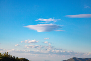 flying saucer shaped white cloud