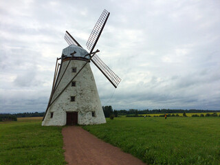 Fototapeta na wymiar Old mill in a field in Estonia