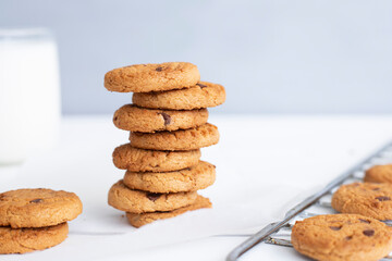 Biscuits with milk on wood background in the morning