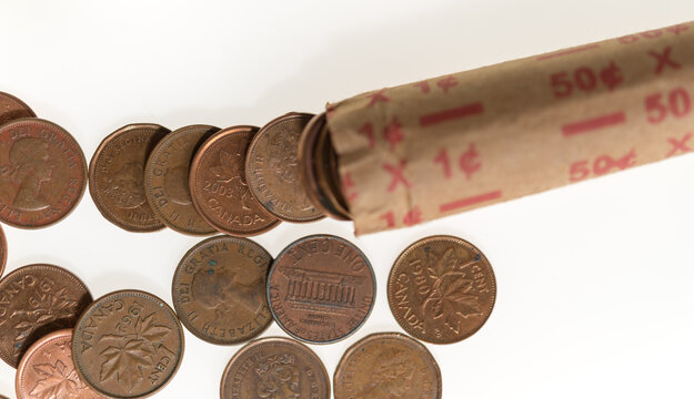 1¢ Penny Roll With Mostly Old Canadian Pennies And American Coins On White