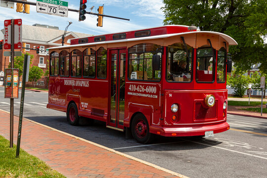 05-02-2021 Annapolis, MD, USA: A red historic trolley bus operated for discover Annapolis city sightseeing tours in the state capital of Maryland. A tourist attraction in this beautiful city.