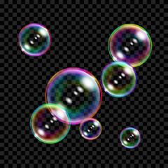 Set of several translucent colored soap bubbles on transparent background. Transparency only in vector format