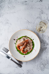 Top view of expensive risotto with big prawns
