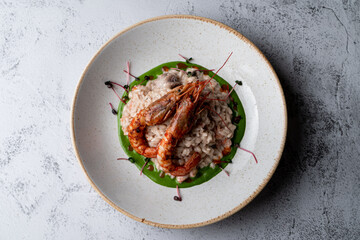 Top view of expensive risotto with big prawns