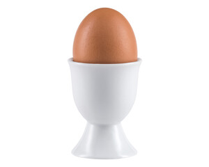 Egg in Egg cup. Ceramic eggcup for breakfast. Holder stand for boiled or raw chicken eggs on white isolated background. Macro close-up photography.