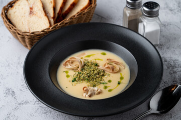 Menu photography setting for a restaurant, cheddar cheese soup, top view on a gray stone table
