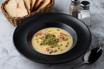 Menu photography setting for a restaurant, cheddar cheese soup, top view on a gray stone table