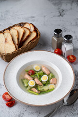 Diet and very light soup with salmon and broccoli in vegetable broth