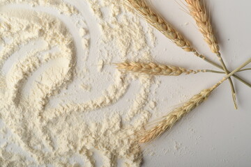Flour, wheat, rice, raisins and coins on a white background