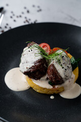 Nourishing restaurant meal: mashed potato with filet mignon and creamy garlic sauce, close appetizing view