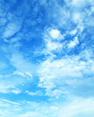 The sky is large, bright, beautiful and has white clouds.