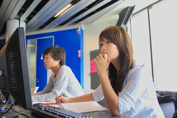Japanese student couple studying together at university 
