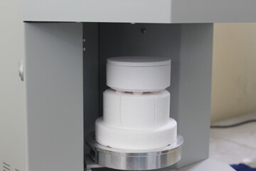 firing the zirconia crown in the oven with high temperature. Dental crown.