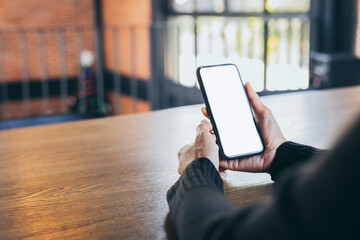 cell phone blank white screen mockup.woman hand holding texting using mobile on desk at office.background empty space for advertise.work people contact marketing business,technology