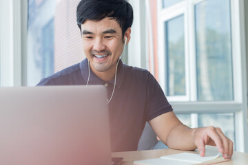 asian man work using computer hand typing laptop keyboard contact us.student study learning education online.adult professional people chatting search at office.concept for technology device business