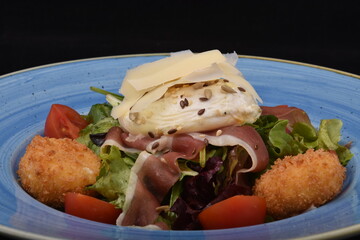 salad with salmon, cheese, and various seeds
