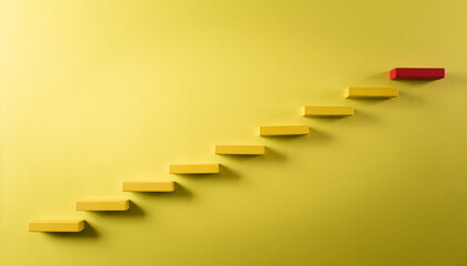 Concept of building success foundation. Yellow and red wooden block stacking as step stair, Success...