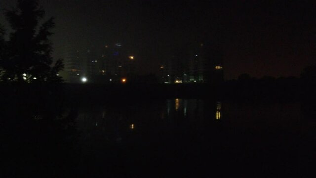 Left To Right Pan Of Forest Apartment Complex At Night Searching For Missing Persons