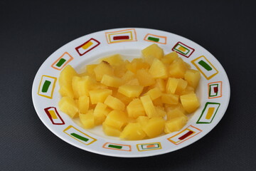 pieces of pineapple on a plate