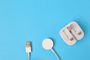 Smartwatch magnetic charging cable isolated on a blue background