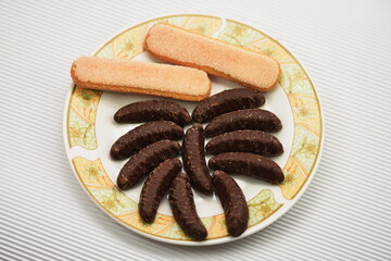 ,Mini  banana and ladyfingers  covered with chocolate foam 