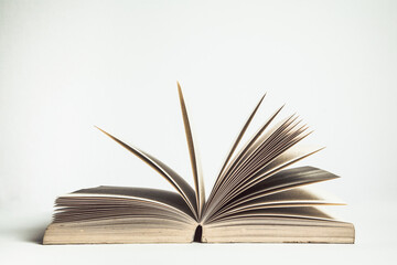An open book isolated on white background