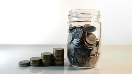 Coin in glass bottle, Investment business, retirement, finance and saving money for future concept.